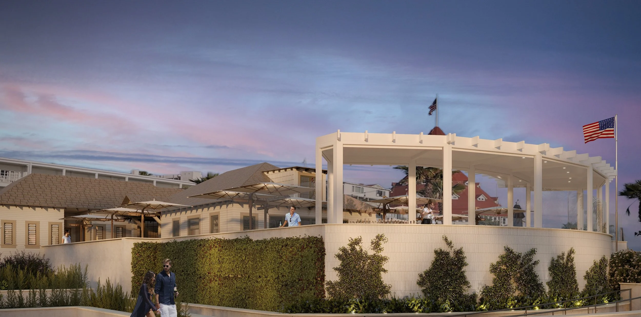 Outdoor view of a modern building with a large white pergola, American flags, and people walking and standing, during sunset with colorful sky.