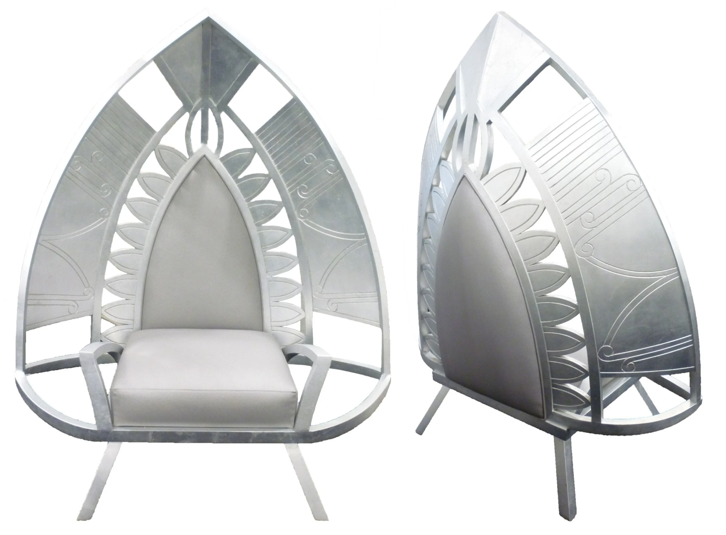 Two modern white chairs with high, pointed, arch-shaped backs featuring leaf-like decorative cutouts, set against a plain white background.