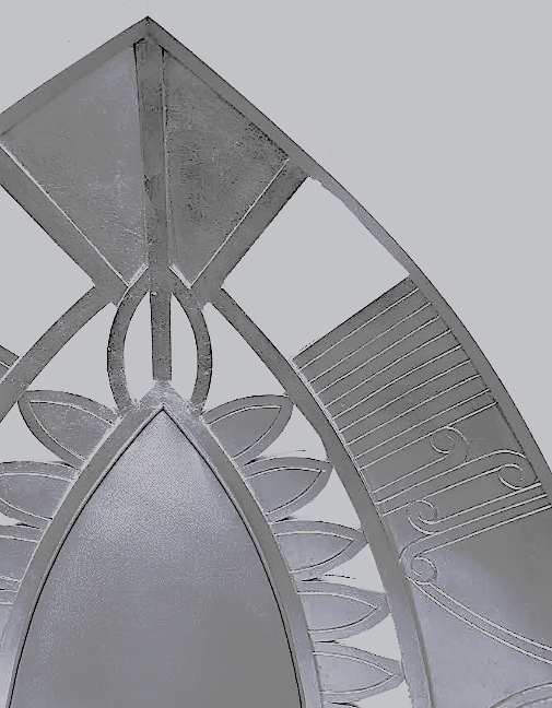 Close-up view of a decorative metal mirror with a floral and geometric design.