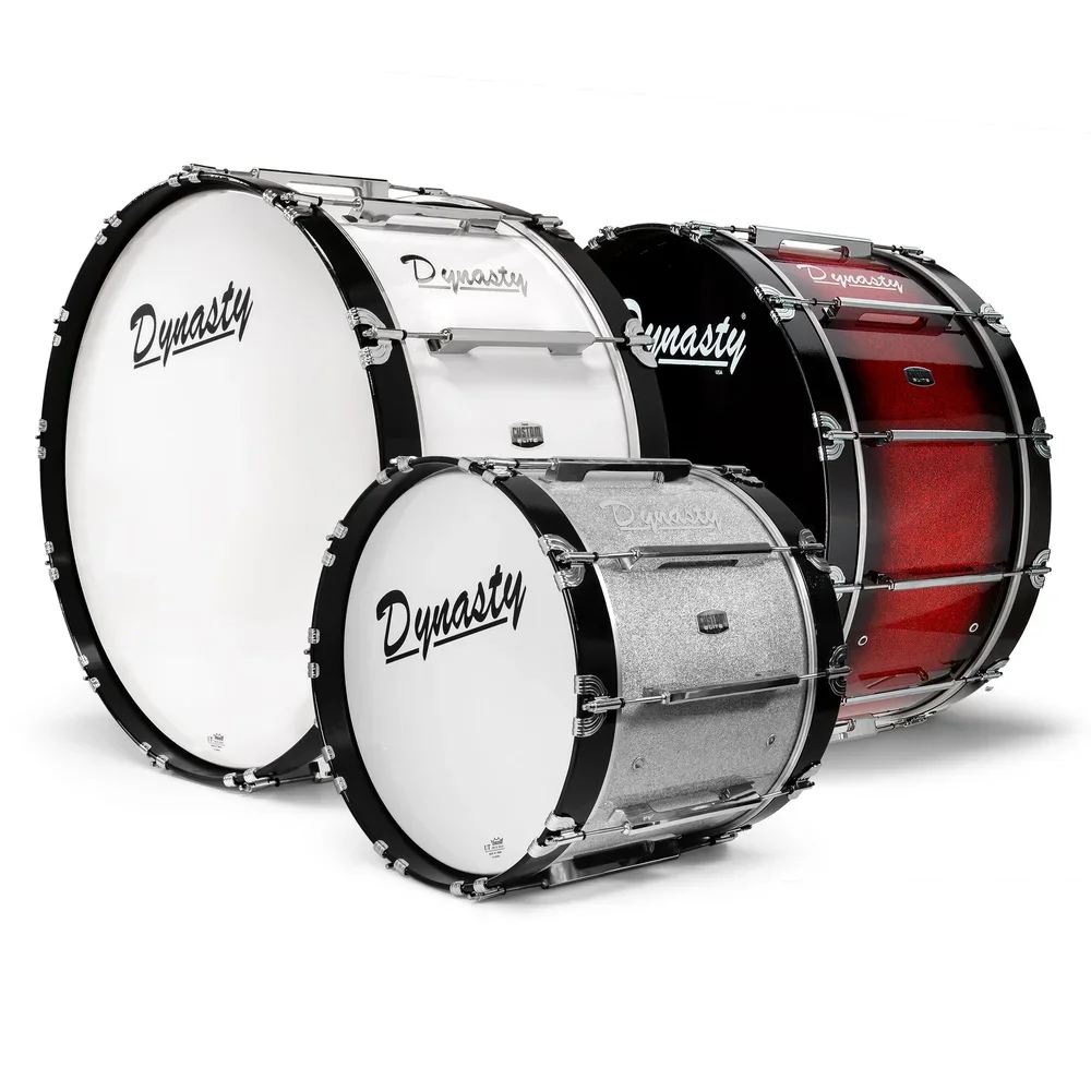 A set of four drums in different sizes and colors, featuring the brand name 'Dynasty' on their drumheads.