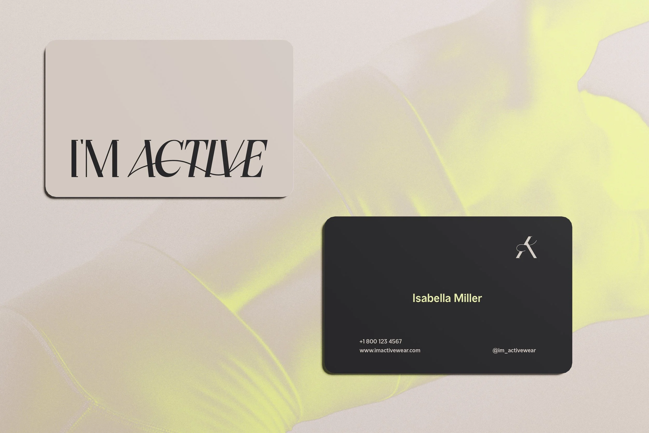 Business card and logo for IM Active, featuring contact details and a stylized 'A' logo on a beige and yellow background.