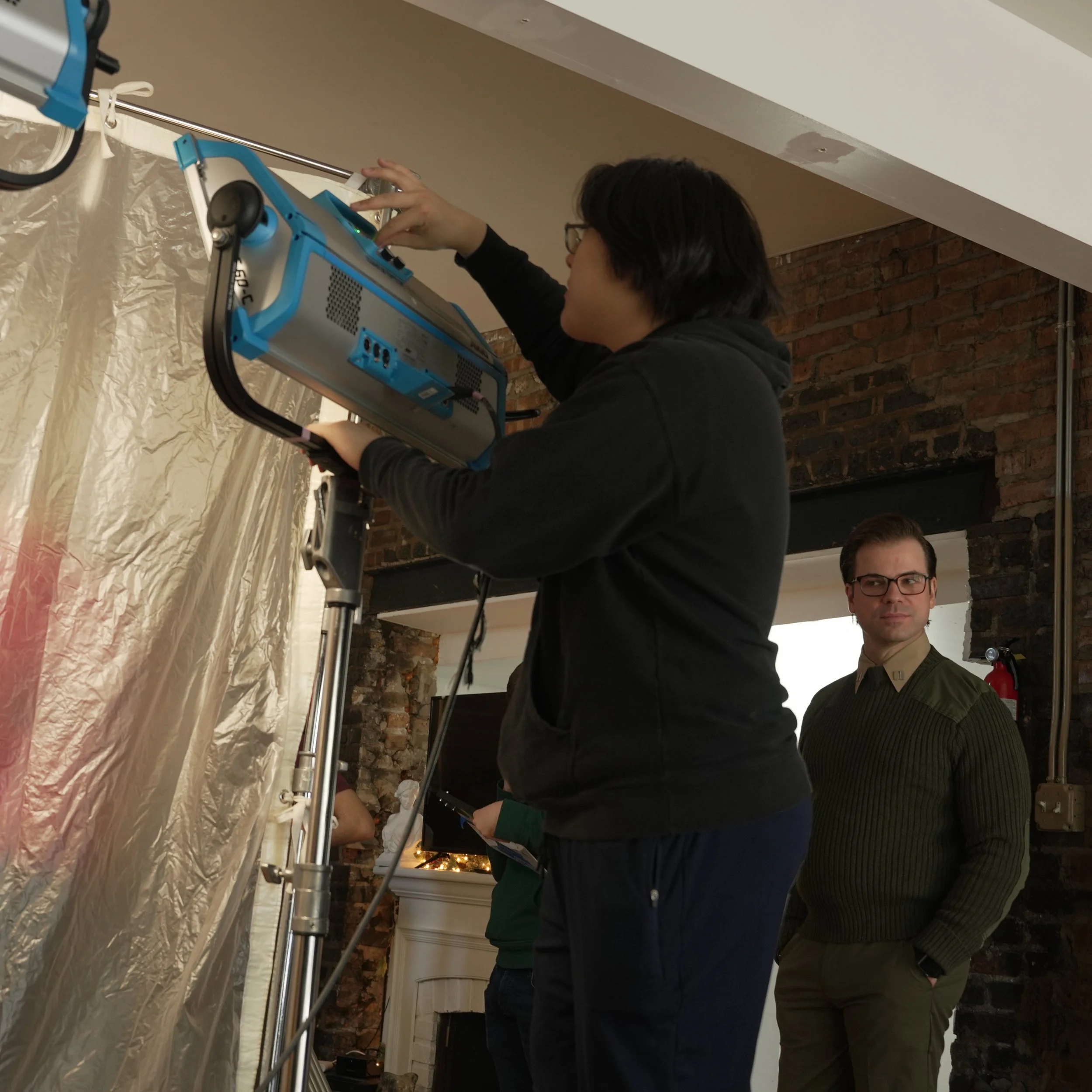 Some BTS of me setting up an ARRI Skypanel through a shower curtain to soften some light.