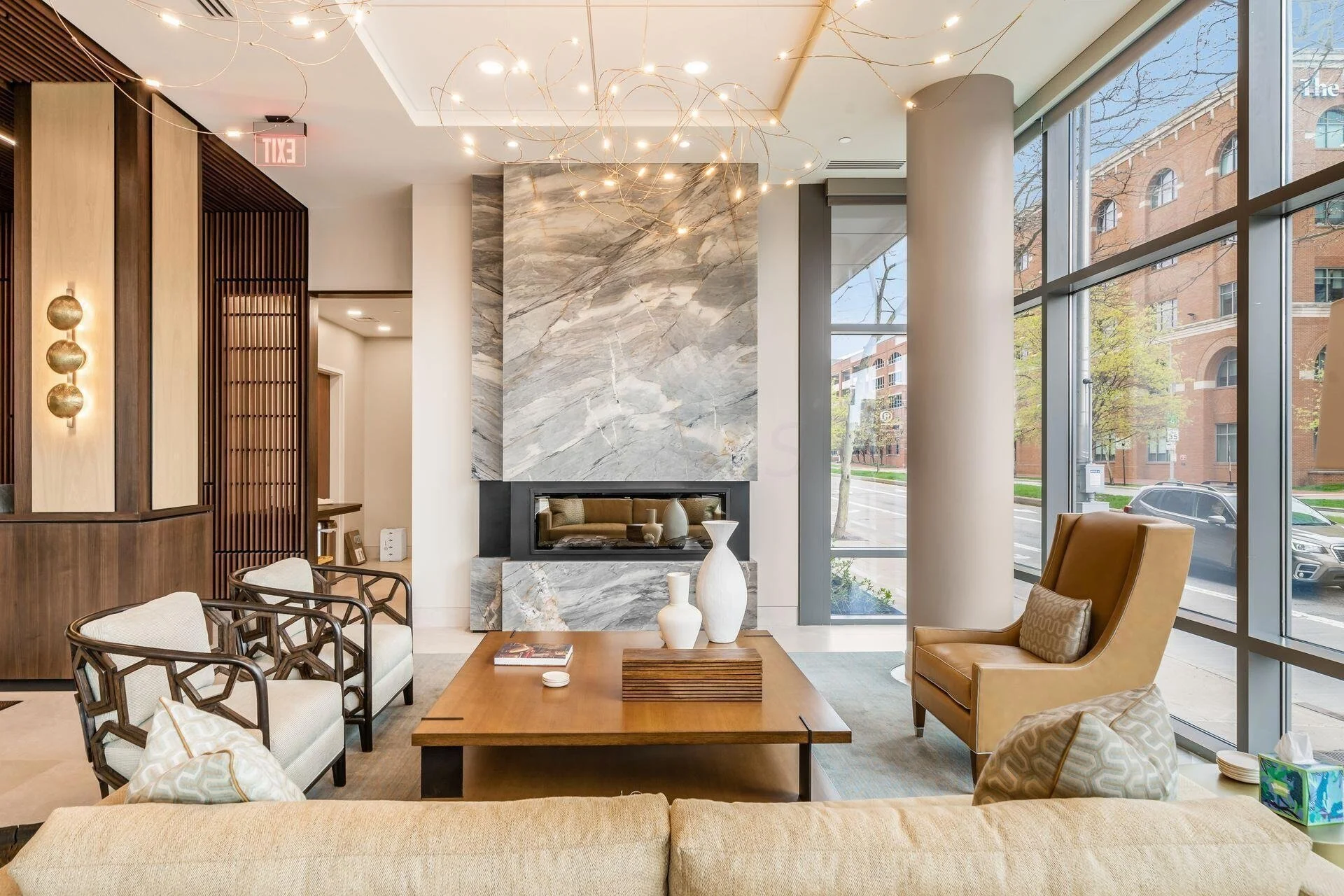 modern fireplace and seating area in a condo lobby