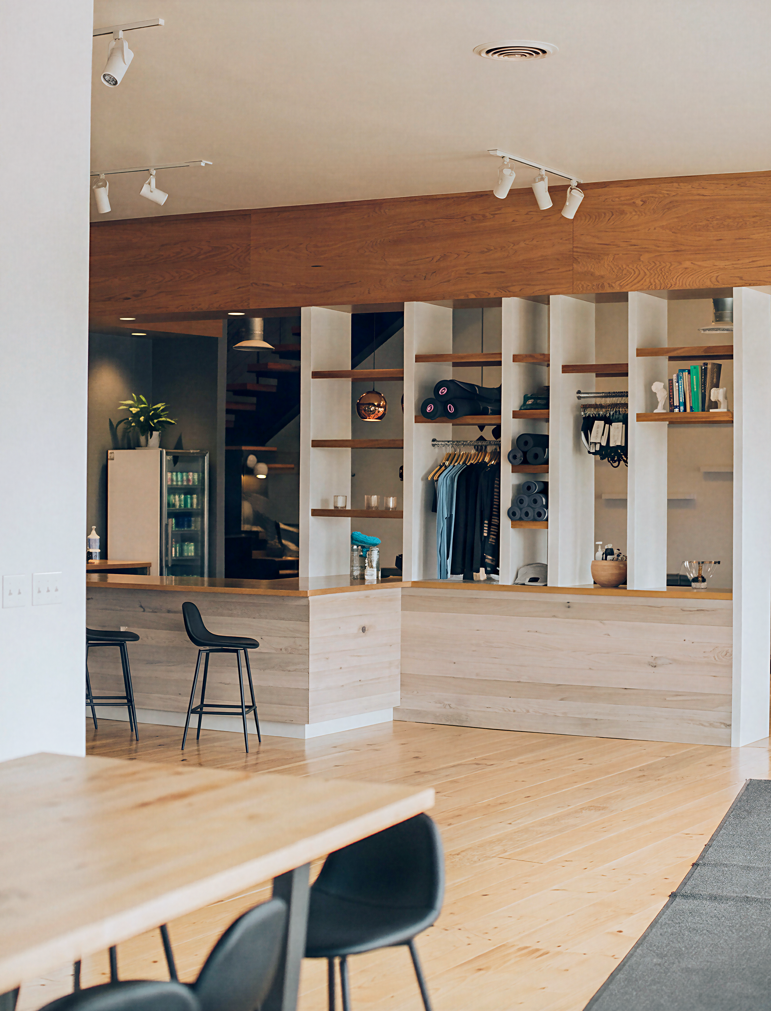 Retail shelving at studio entrance.