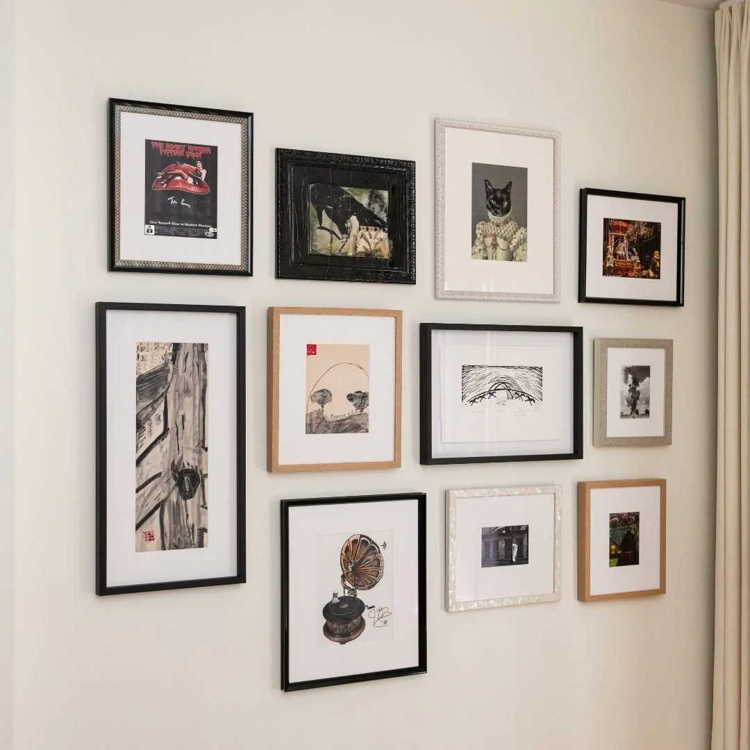 Creating gallery walls is a fun way to showcase our clients collections of prints, postcards, art, and children's artwork. Thanks to BlackBird Frame & Art in Asheville @blackbirdframe for assisting with the custom matting and framing for this cli