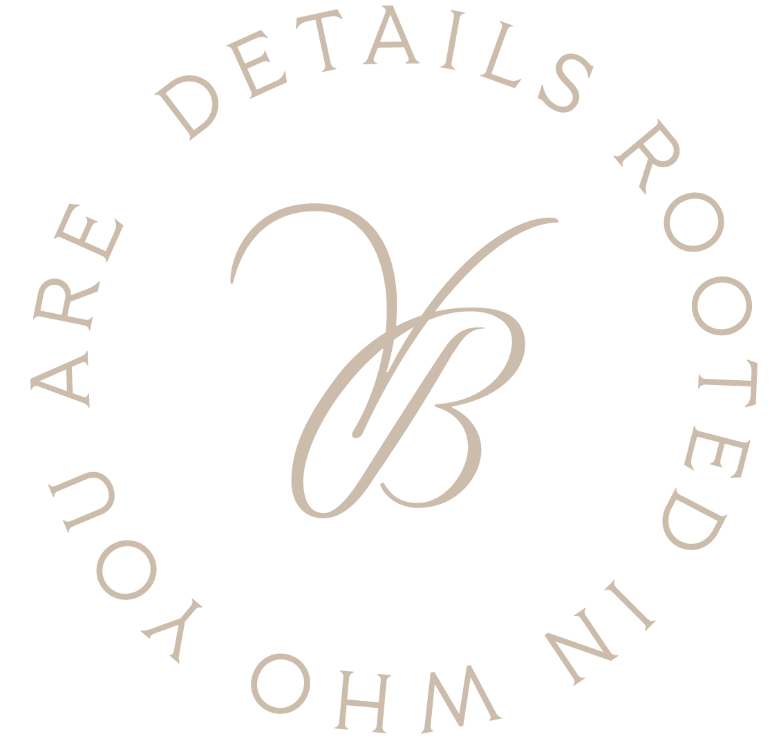 Logo with a large, stylized letter 'B' in cursive at the center, surrounded by the text 'IN YOUR HANDS ARE DETAILS ROOTED IN' in a circular arrangement.
