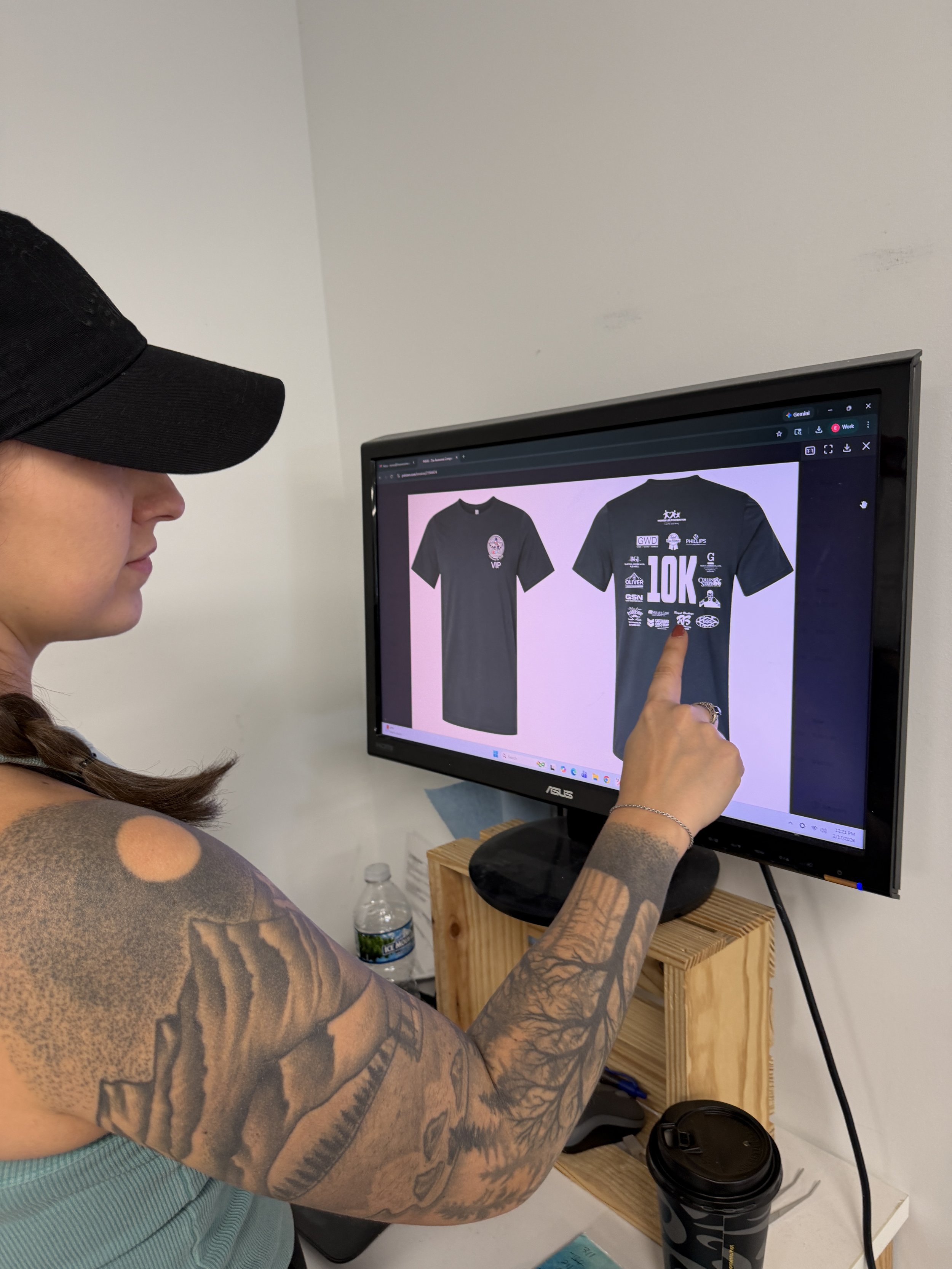 Employee checking the design on computer screen.