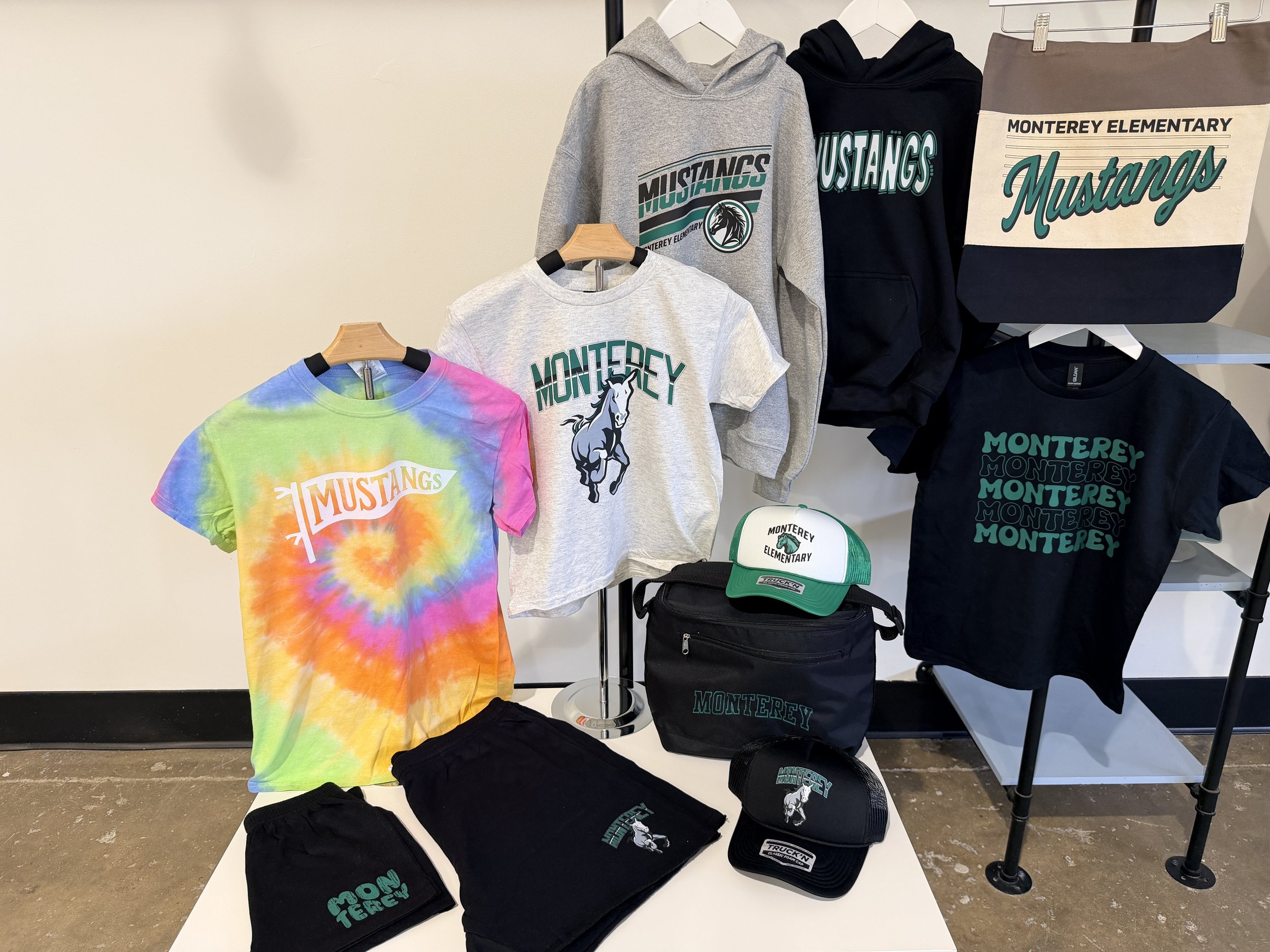 A variety of Monterey Elementary Mustangs school spirit shirts.