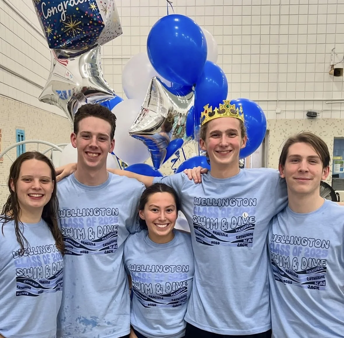 Group wearing matching custom event shirts at a school or team event.