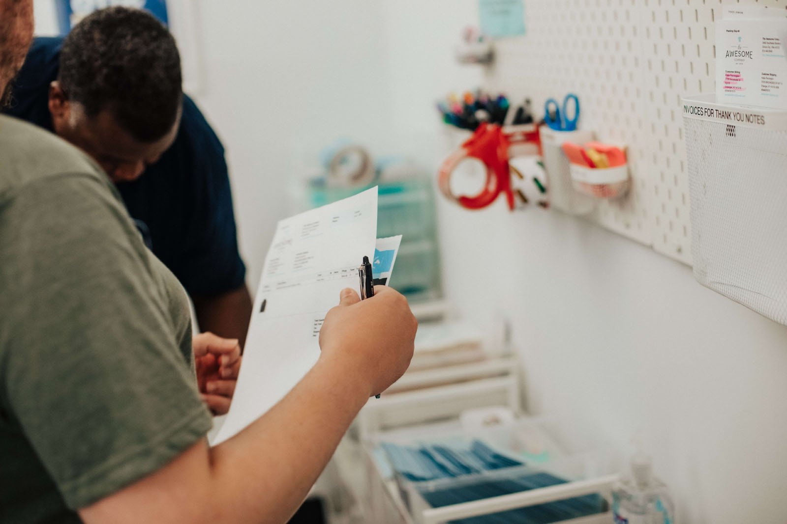 Labeled shelves and organized work tools showing a structured, autism friendly workspace.