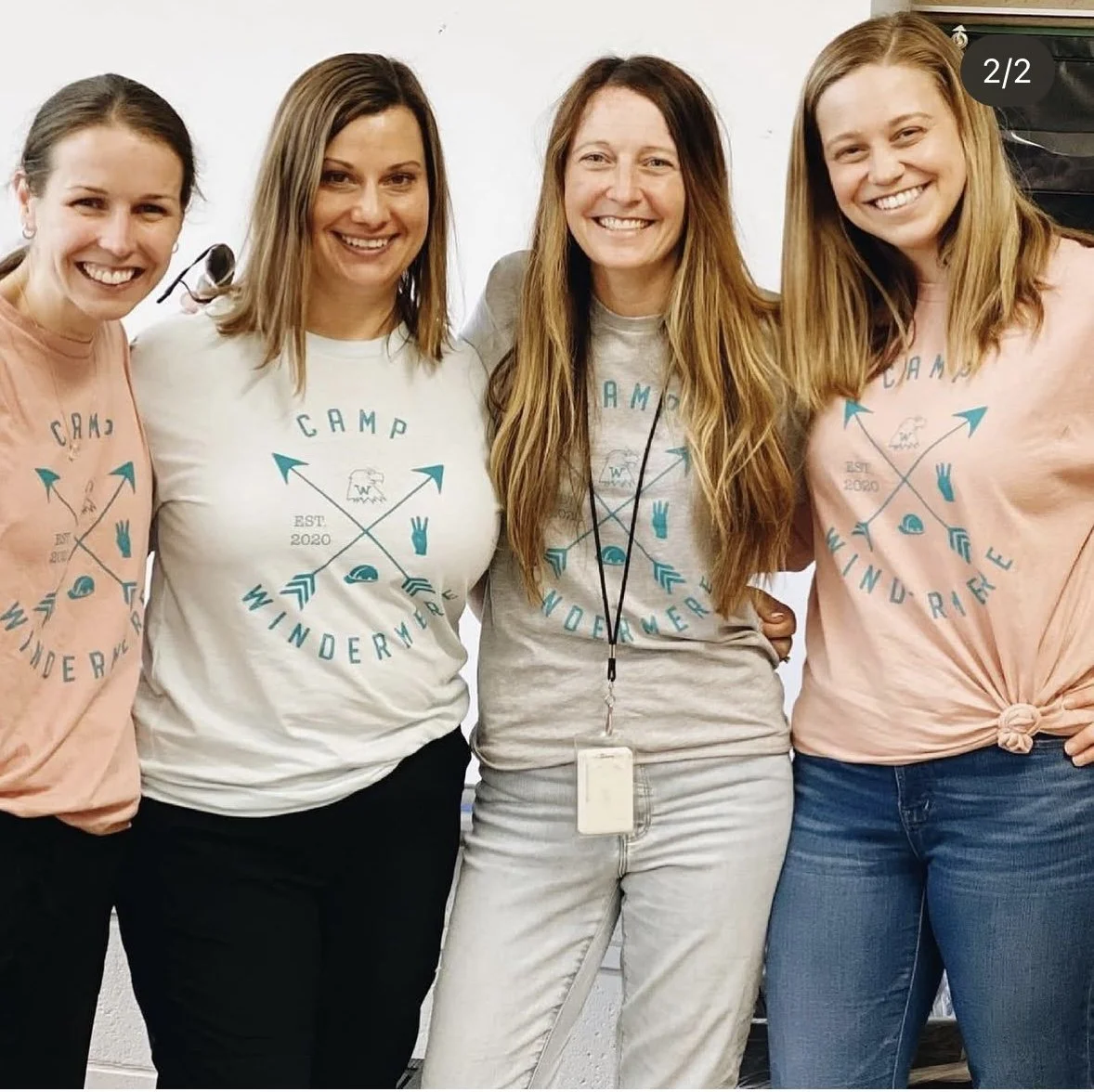 Family smiling together wearing their custom annual camp windermere shirts.