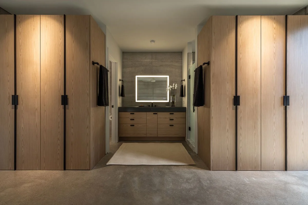 Subtle lift lines in Rammed Earth wall behind vanity.