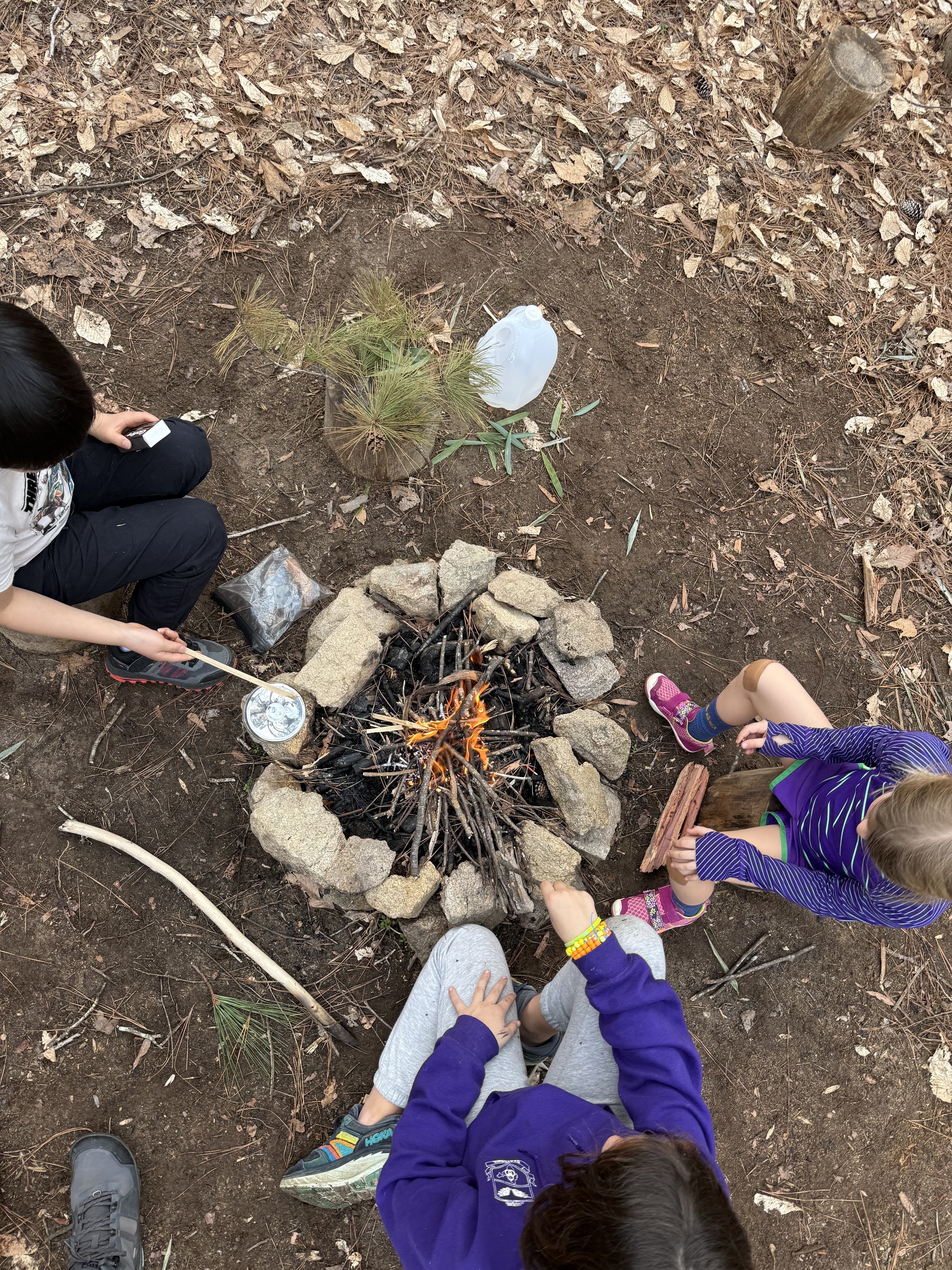Children gathered around a fire