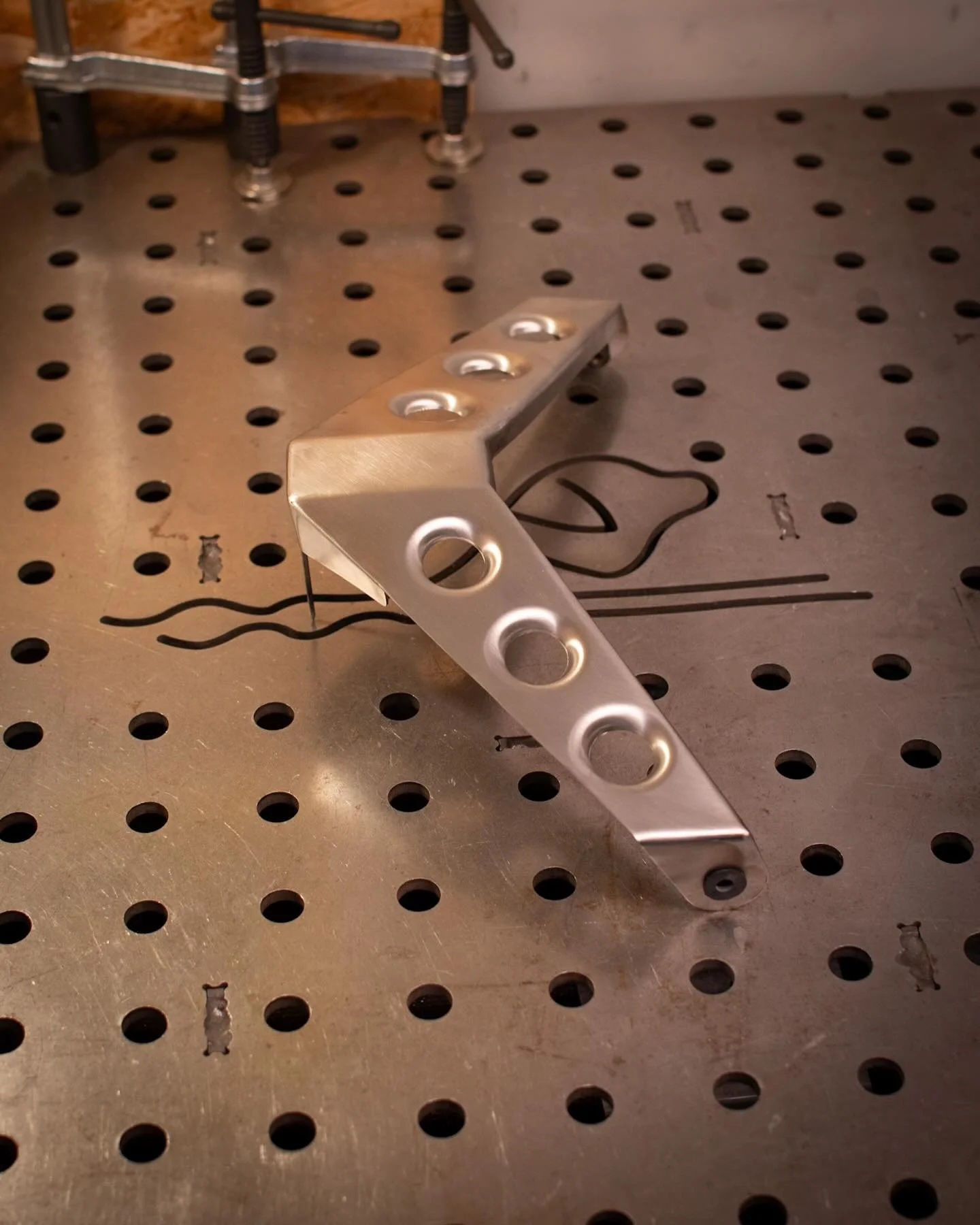 Just a bracket, no more no less. It&rsquo;s got speed holes though! 

It&rsquo;s for mounting the lower fairing and will attach to the underside of the frame. The rubber well nuts will help isolate vibration.