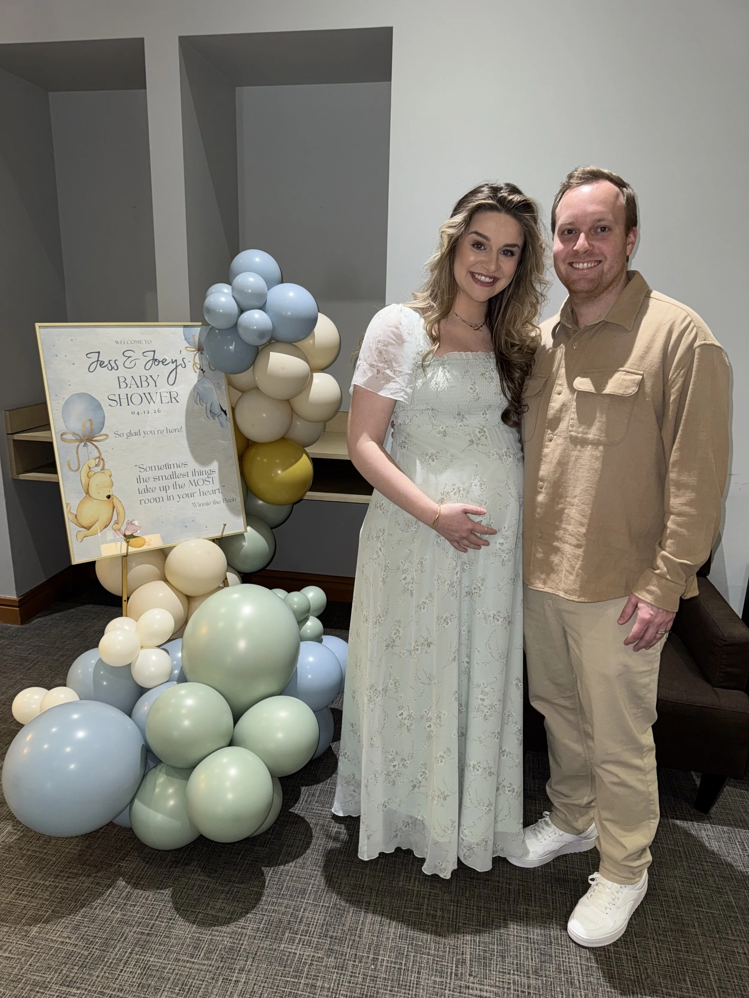 Welcome sign with couple.jpg