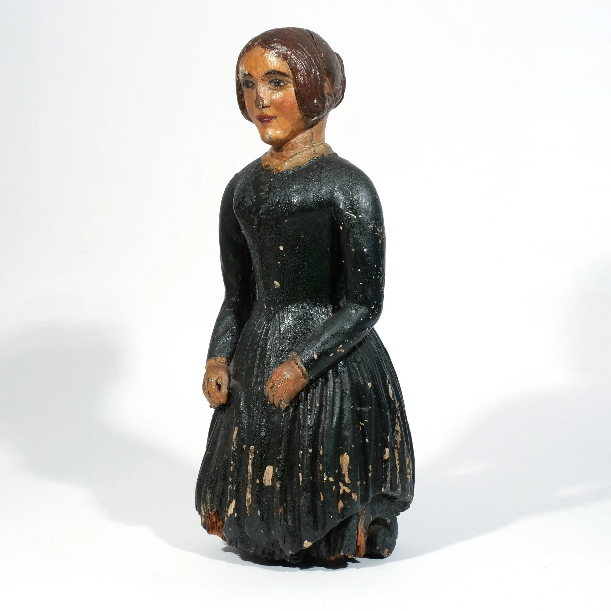 CARVED POLYCHROME SHIP'S FIGUREHEAD 
19th century, carved wood and painted yacht's figurehead in the form of a young woman holding a fan, h. 23 in. 
 Hammer: $7,000