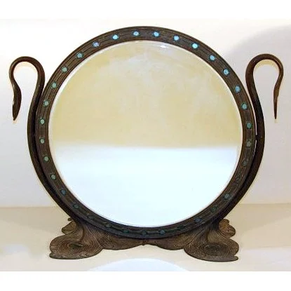 Tiffany Studios bronze and glass 'Peacock' mirror', early 20th Century, from a Ridgefield, CT estate, sold in March 2009 
 Hammer: $31,200