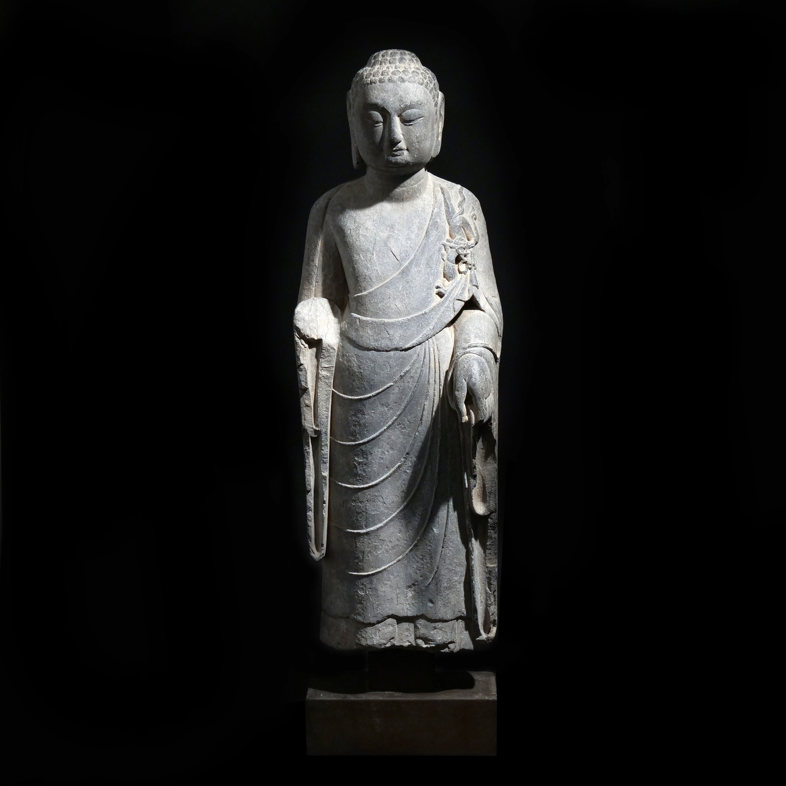 NORTHERN QI / SUI DYNASTY LIMESTONE BUDDHA 
China, circa 550-618 CE 
h. 36 in. (on stand) 
$5,000-10,000