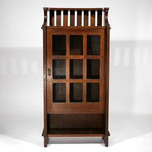 EARLY GUSTAV STICKLEY OAK BOOKCASE, #512 
Circa 1901, having a glazed door with three interior shelves 
Sold in November 2021 
 Hammer: $50,000