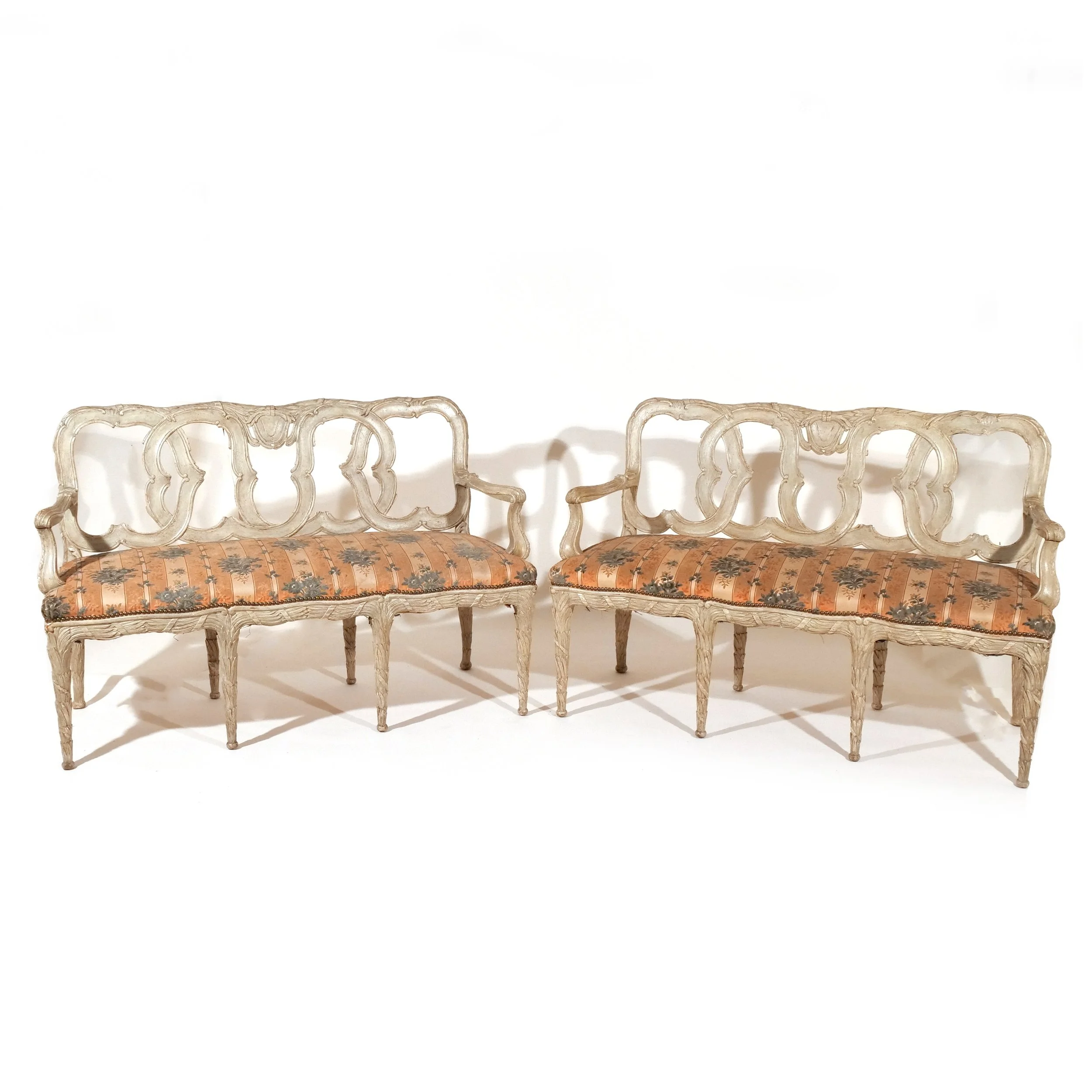 PAIR CANAPES AFTER ARMAND ALBERT RATEAU 
Mid 20th century, heavily carved throughout and in blue paint 
Est: $5,000-7,000