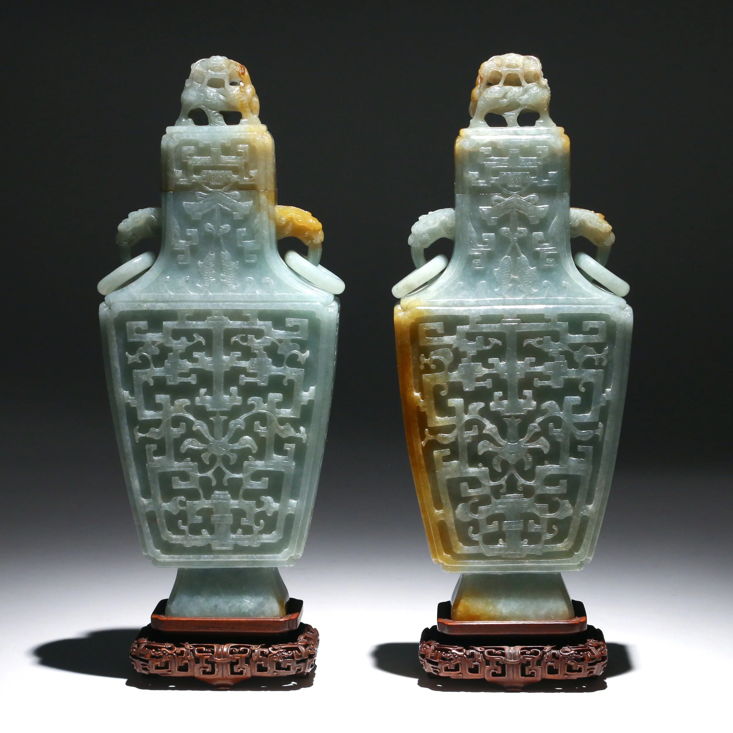 PAIR CHINESE ARCHAISTIC JADEITE VASES & COVERS 
19th/early 20th Century, possibly earlier, the jade of a bluish-white color with russet inclusions, four-character Qianlong reign marks on lids, h. 12-3/4 in. 
Sold in March 2019 
 Hammer: $95,000