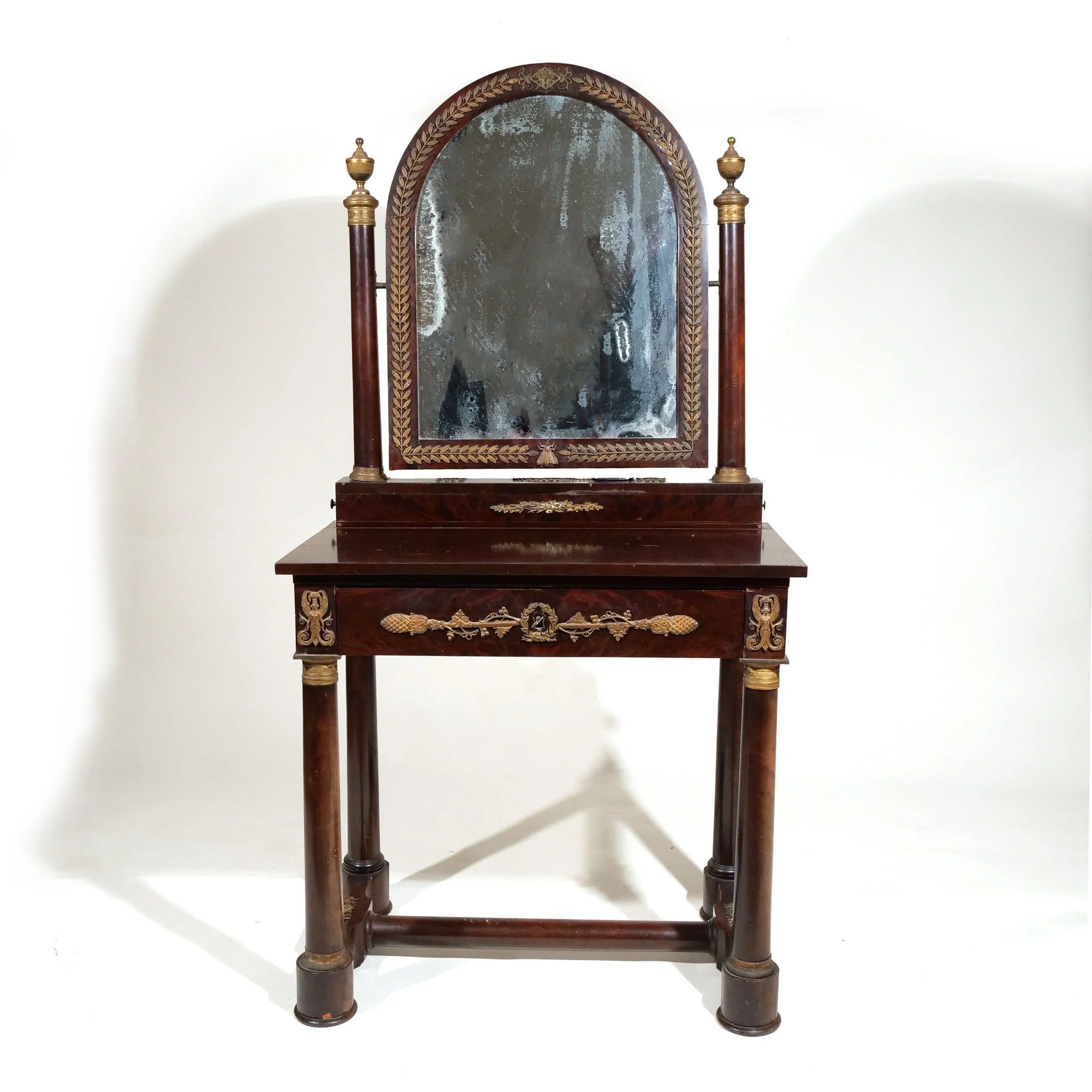 NAPOLEON III CLASSICAL MAHOGANY DRESSING TABLE 
Of small size, having exceptionally chased ormolu mounts including Bumble Bee 
$4,000-6,000