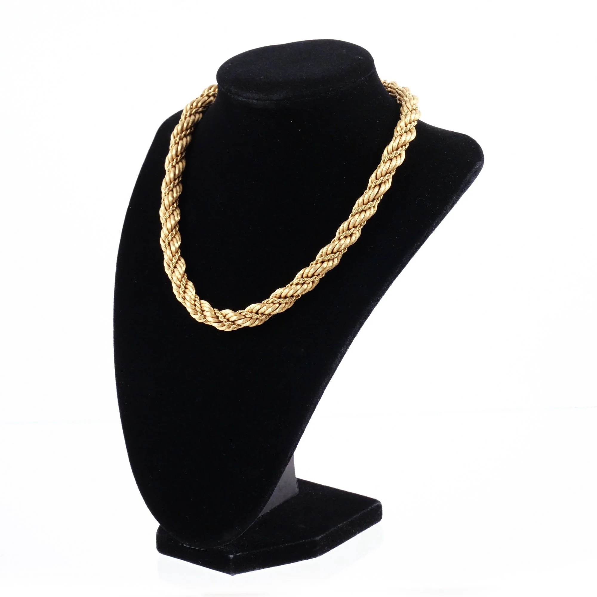 TIFFANY & CO. 18K ITALIAN GOLD ROPE NECKLACE 
Signed 'Tiffany & C.' and marked 'Italy / 18k', l. 16-1/4 in., 68 g w. 3/8 in. 
 Hammer: $10,000