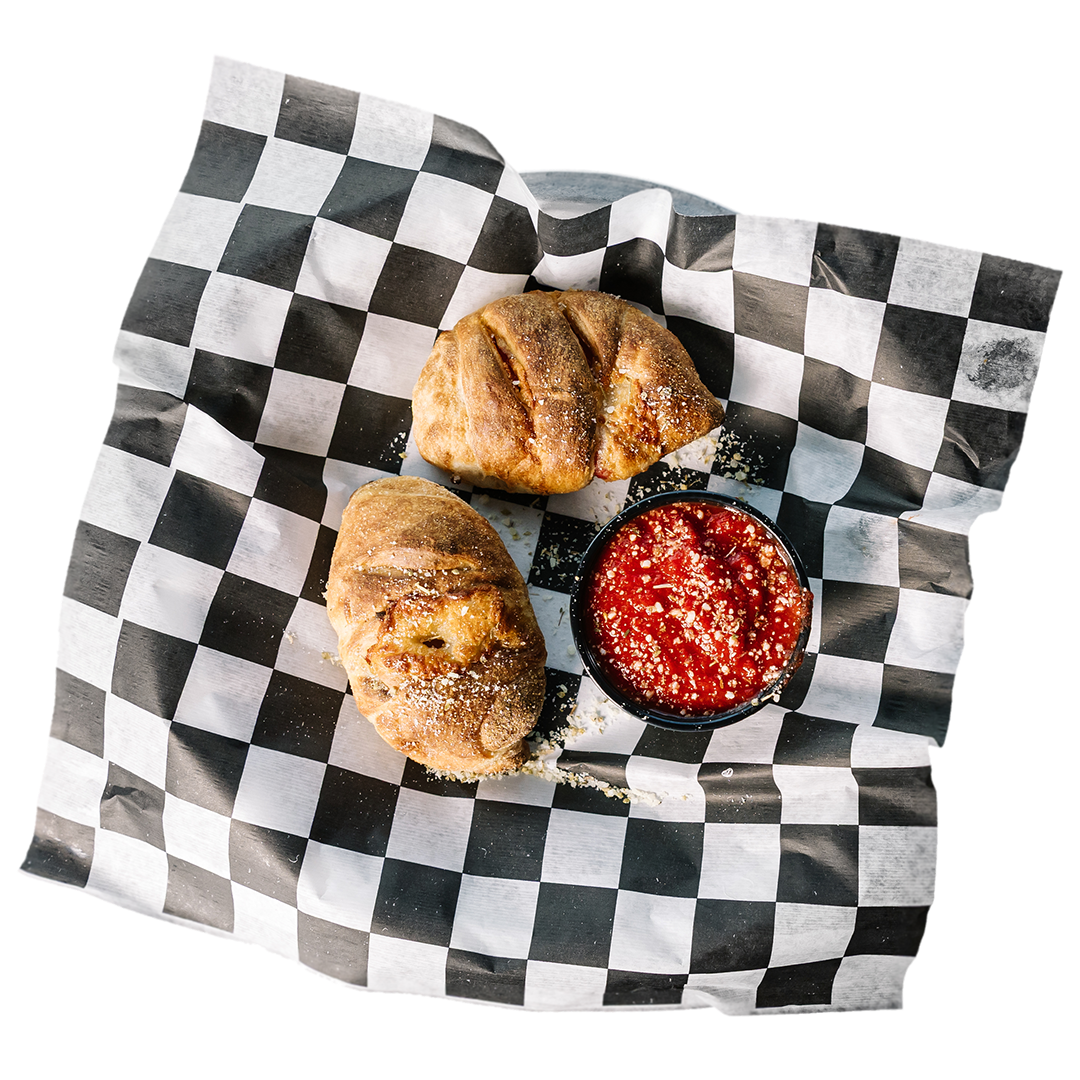 PEPPERONI ROLLS: Charred pepperoni wrapped in mozzarella and baked in house dough