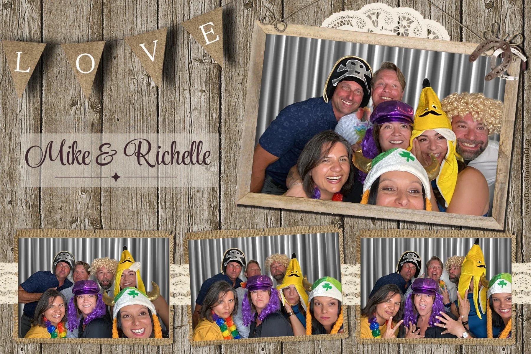 Group of people wearing colorful costumes and funny hats, posing together in a photo booth with metallic backdrop, at a rustic-themed event. Decor includes a wooden wall backdrop with a banner spelling 'LOVE' and lace doily accents.