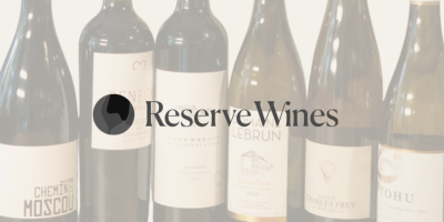 Five wine bottles arranged in a row with a semi-transparent overlay featuring the Reserve Wines logo and text.