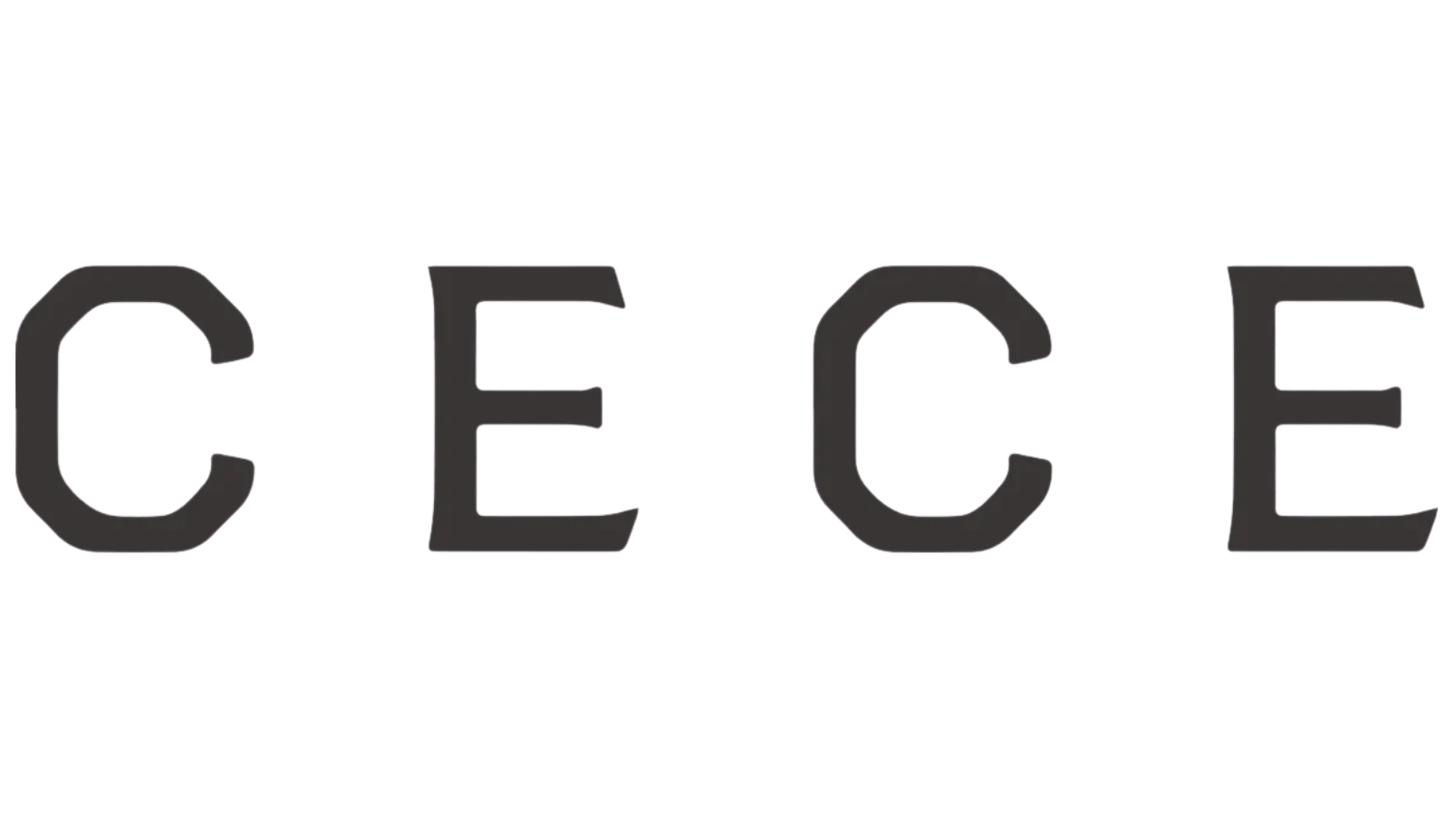 Close-up of a black plastic connector with two metal pins, one with red and green markings, on a green background.