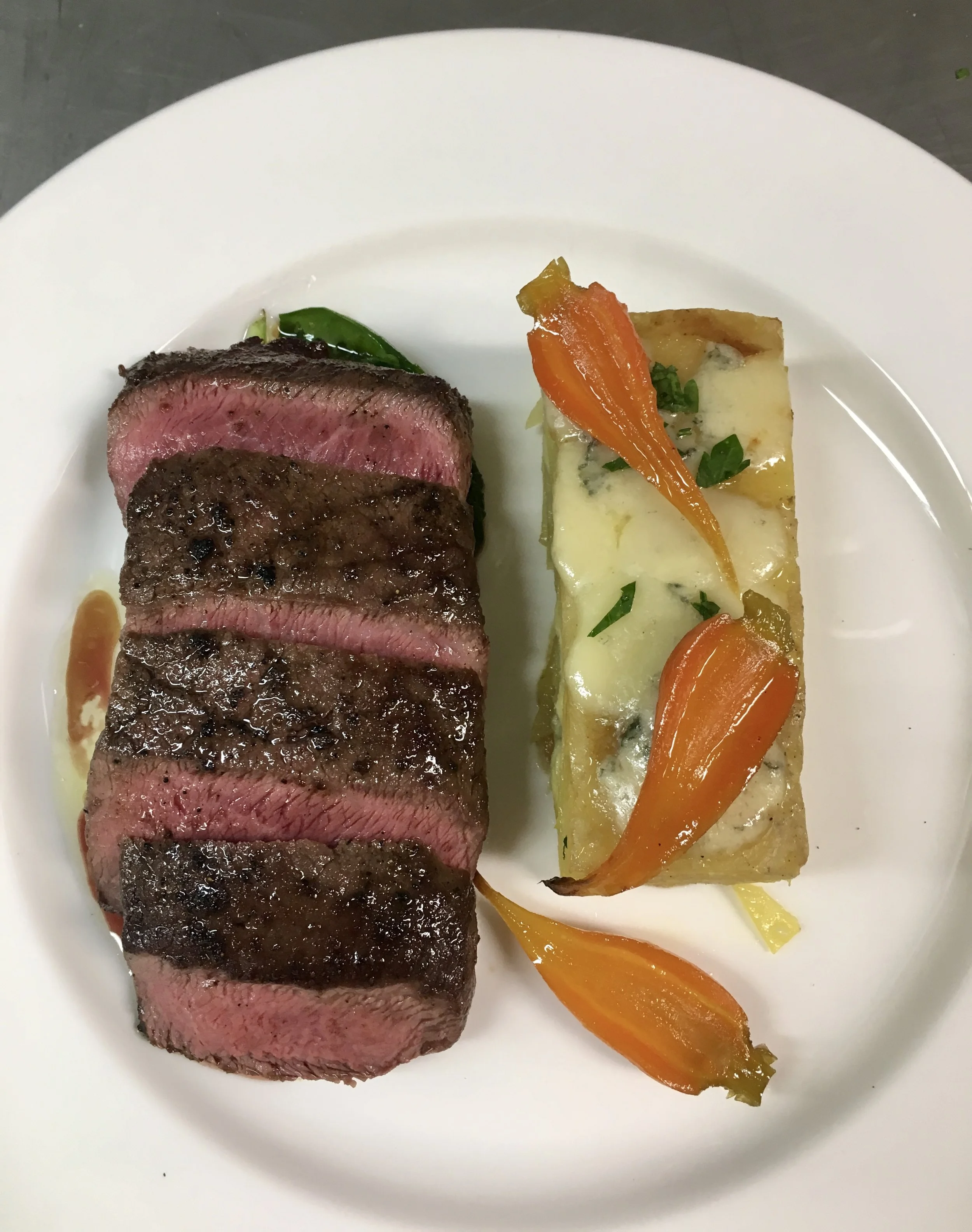 Barvette steak, baby carrots, blue cheese potato au gratin, demi-glace