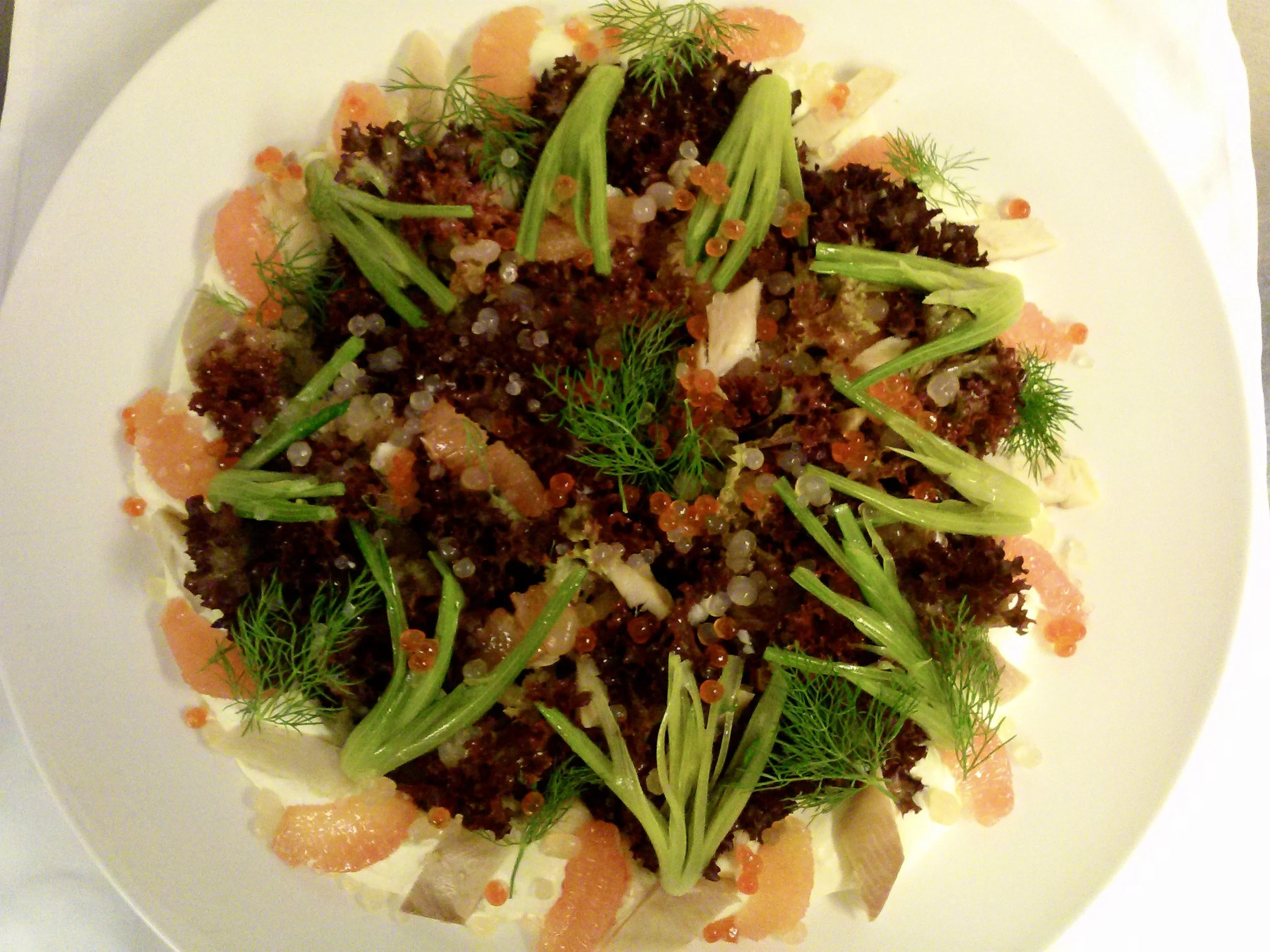 Family style salad with gravlax, salmon roe, champagne and citrus pearls, lola rossa and poached baby fennel