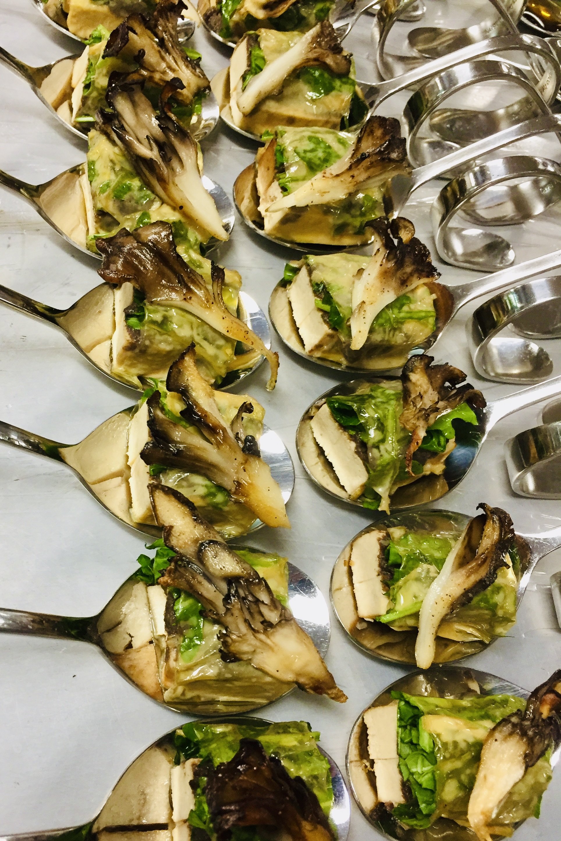 Canapé spoons filled with marinated grilled halloumi, maitake and black garlic duxelles mushroom