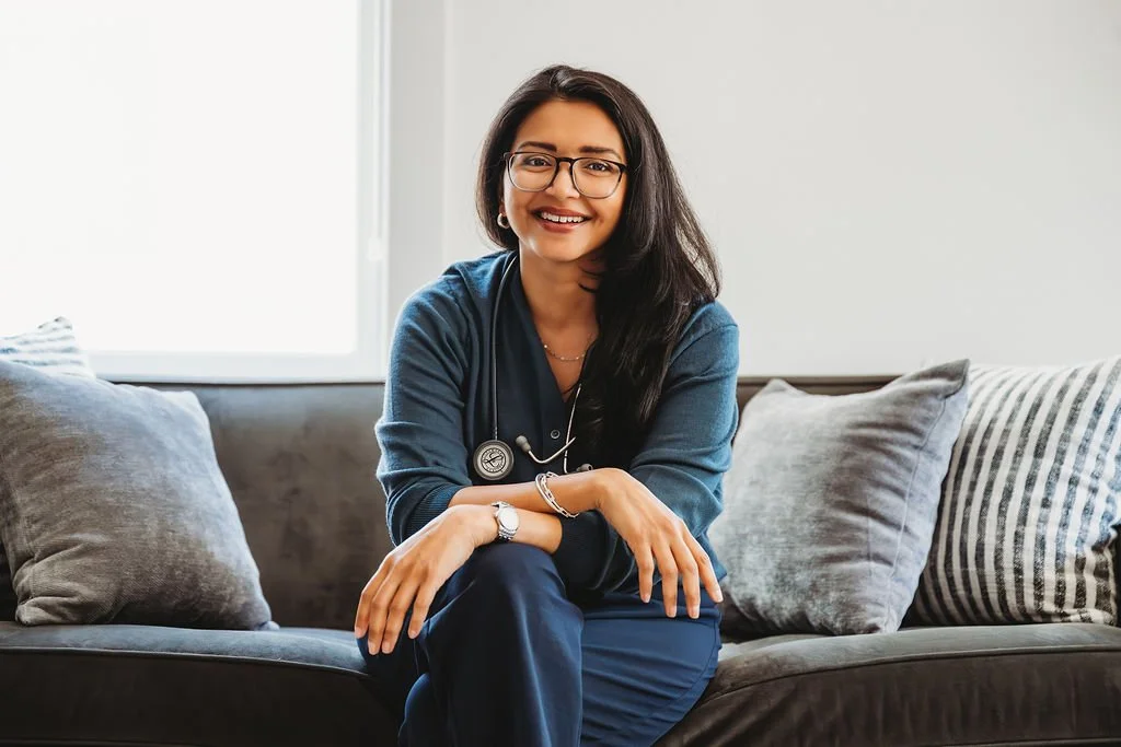 Photo of Dr. Patel with a stethoscope around her neck smiling