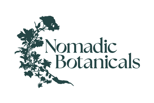 Logo for Nomadic Botanicals featuring a white silhouette of a flowering plant on a black background