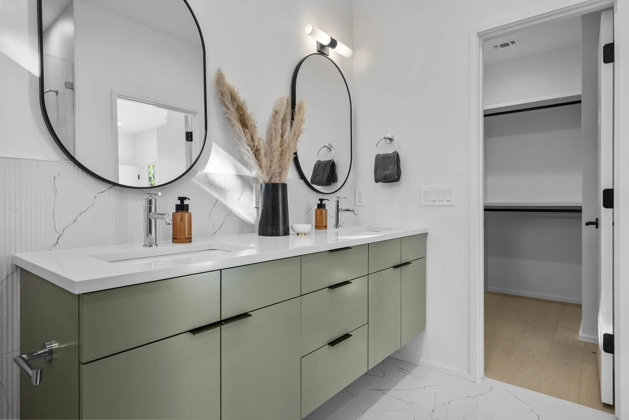 Unit 2 Primary bath with double vanities and large walk in closet