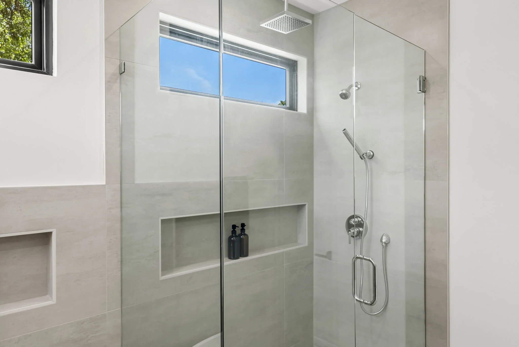 Primary spa shower with multiple shower heads