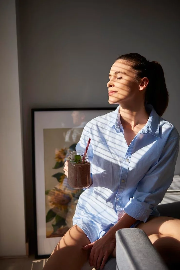 young-woman-drinking-smoothie-home