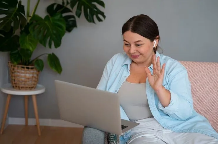 woman-having-video-call-home-laptop-device