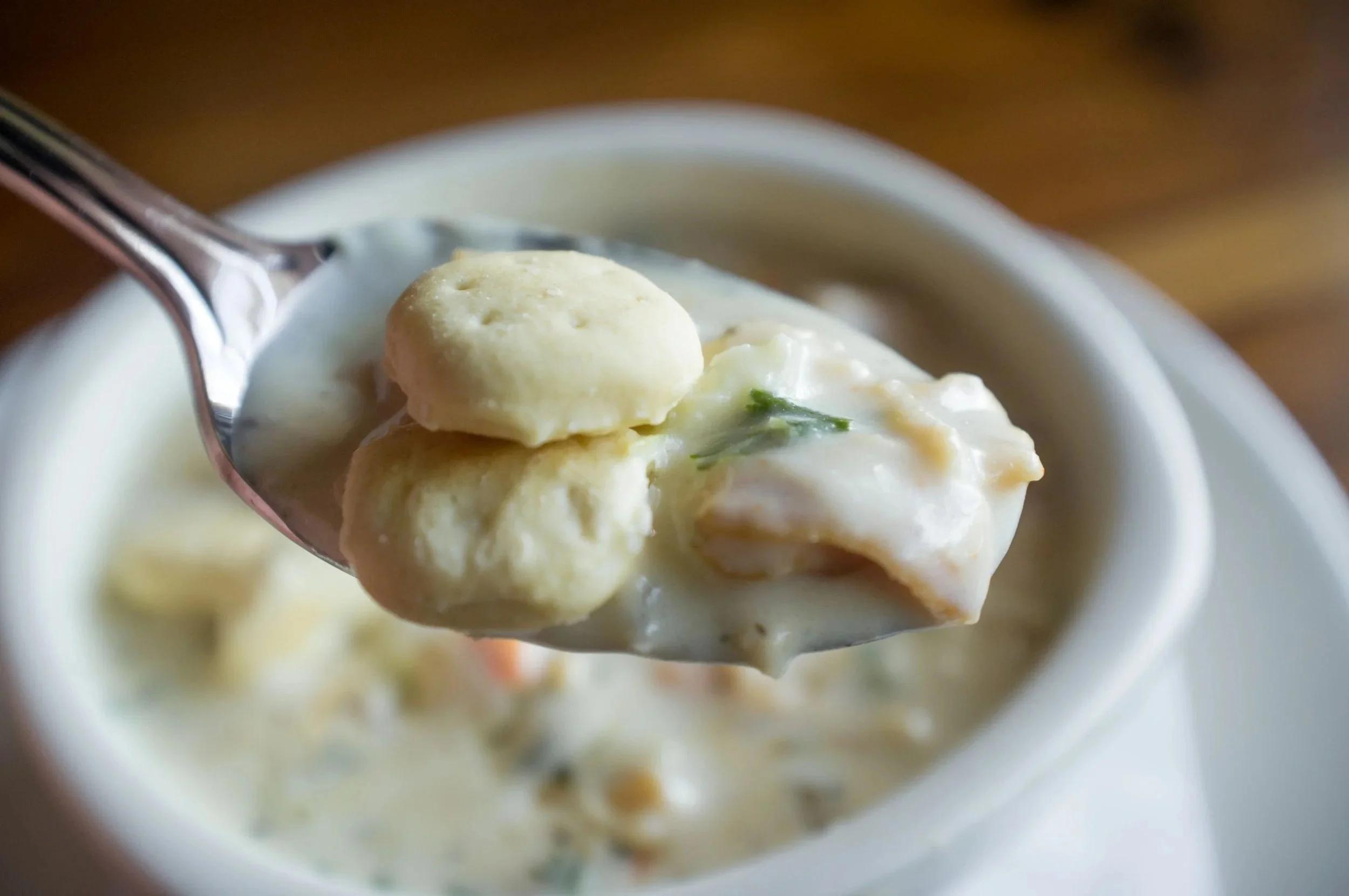 Spoonful of New England Clam Chowder with St Ours Clam Broth