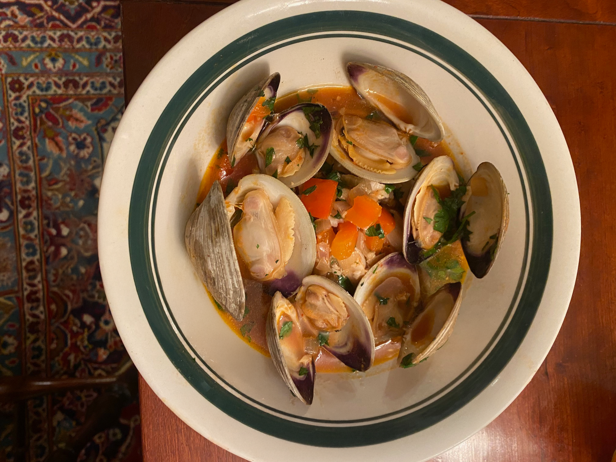 Portuguese Seafood Stew made with St. Ours green crab broth and clam broth. Invasive green crabs aren't only edible, they're delicious and frequently used in Portuguese cuisine.