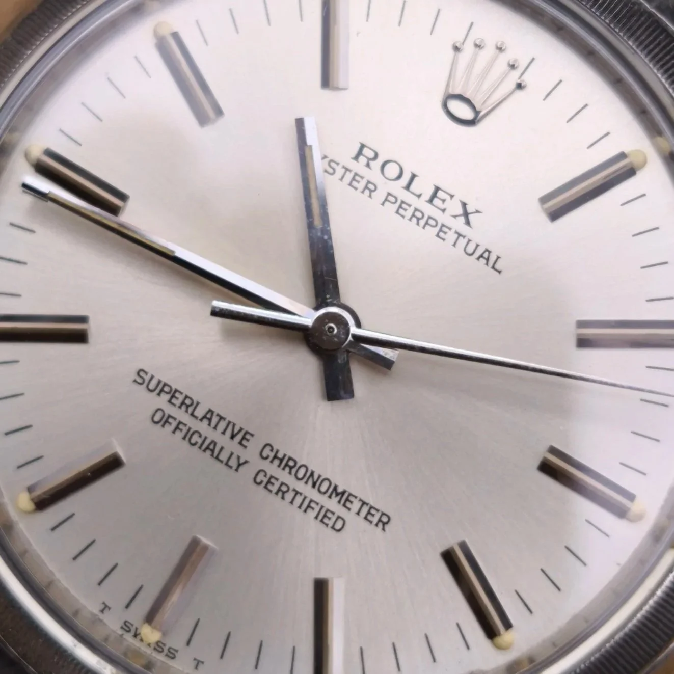 A close-up of a 1963 Rolex Oyster Perpetual, ref: 1003 with a spotless original dial with creamy tritium lume