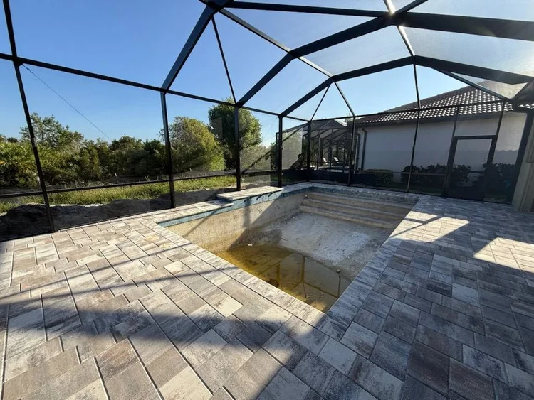 Backyard pool area before pool safety fence installation