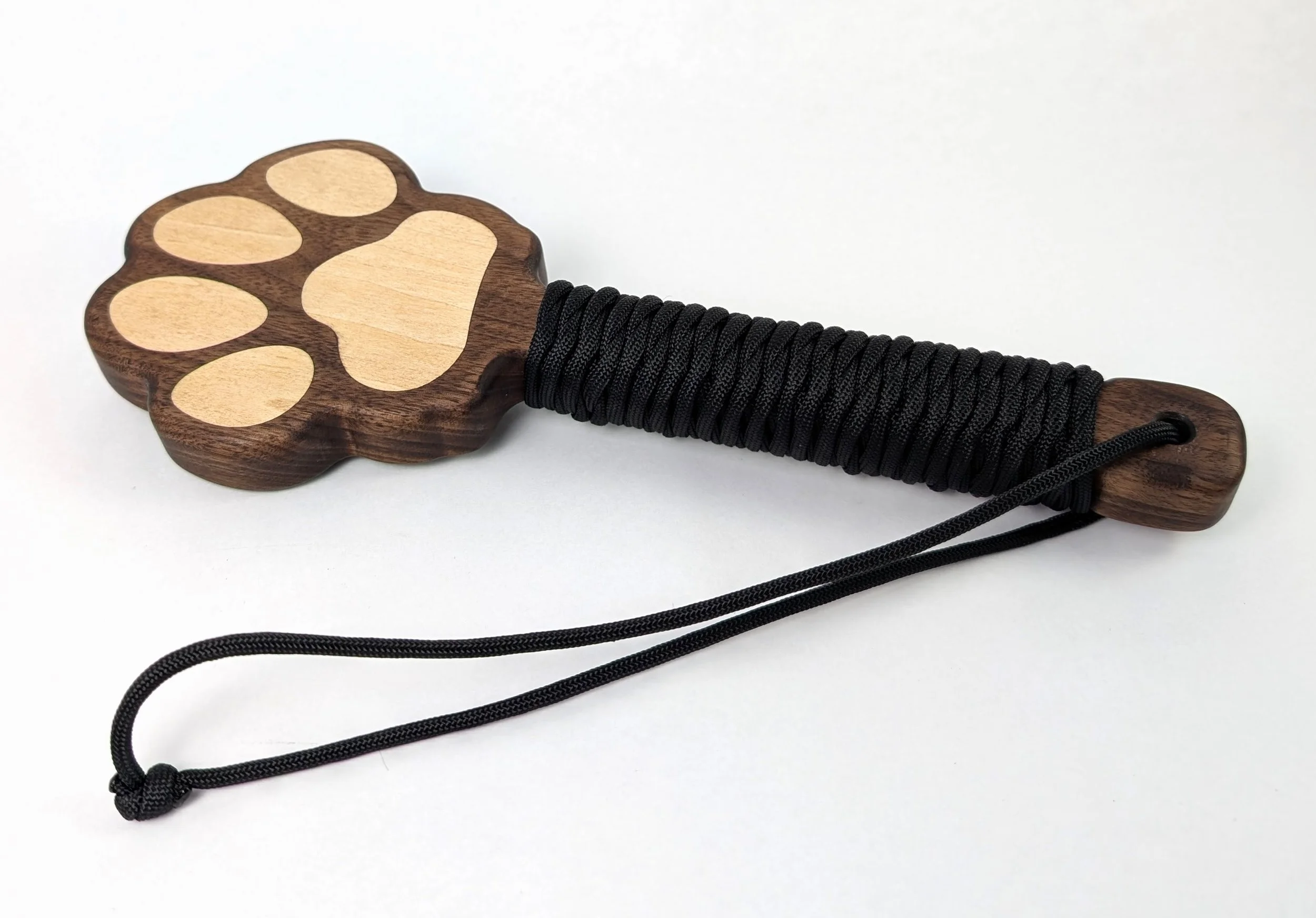 #29 Walnut with flat basswood beans and paracord handle wrap