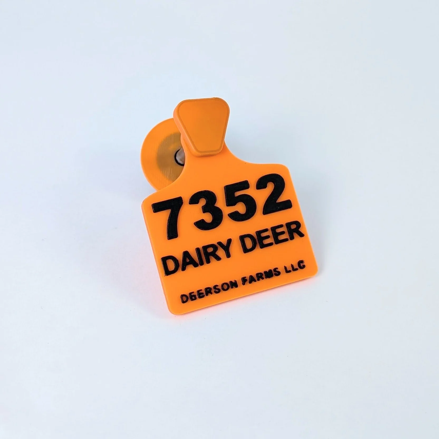 Orange Fursuit Ear Tag with Black text