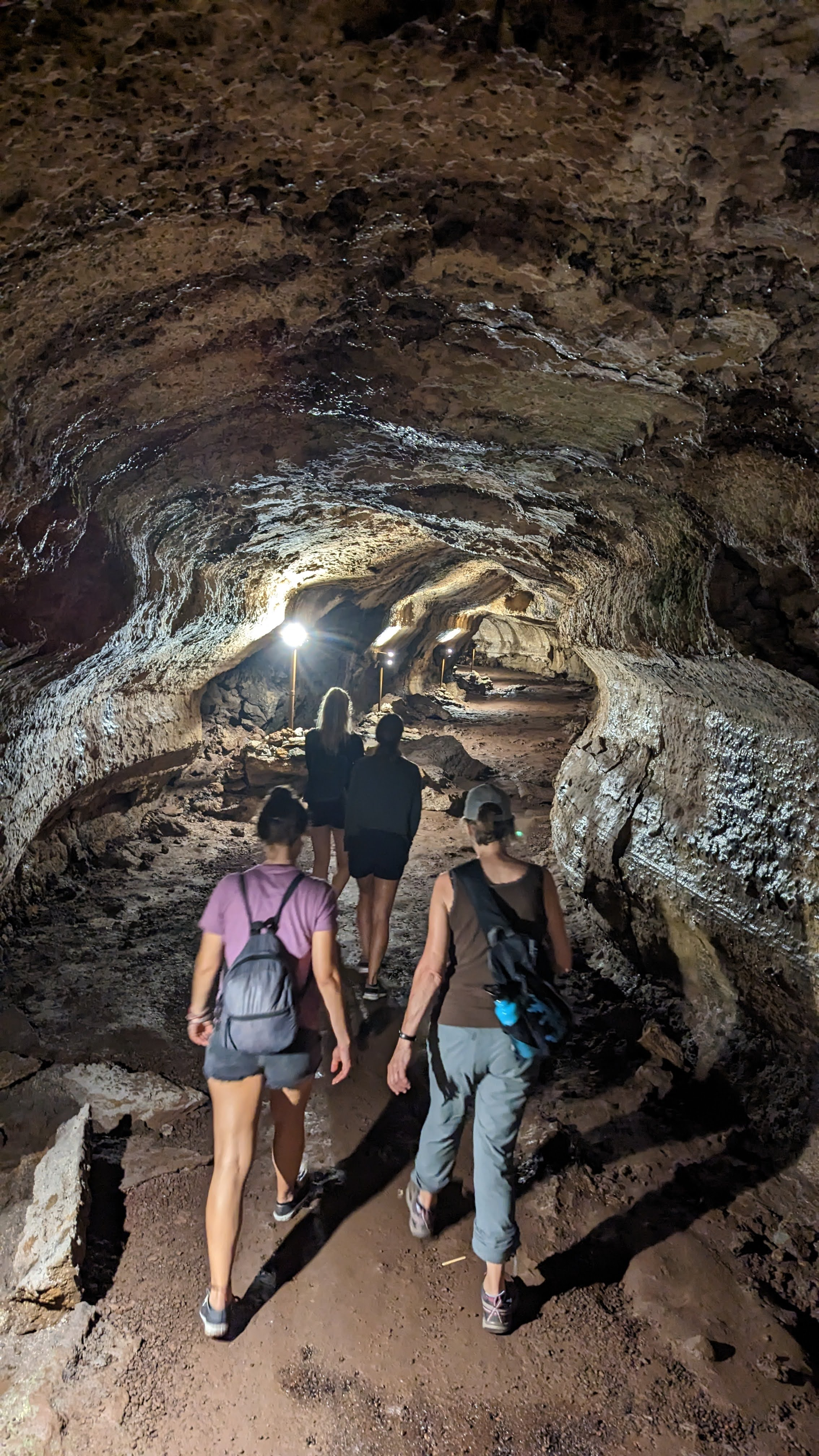 tourists-walking-through-lava-tunnel.webp
