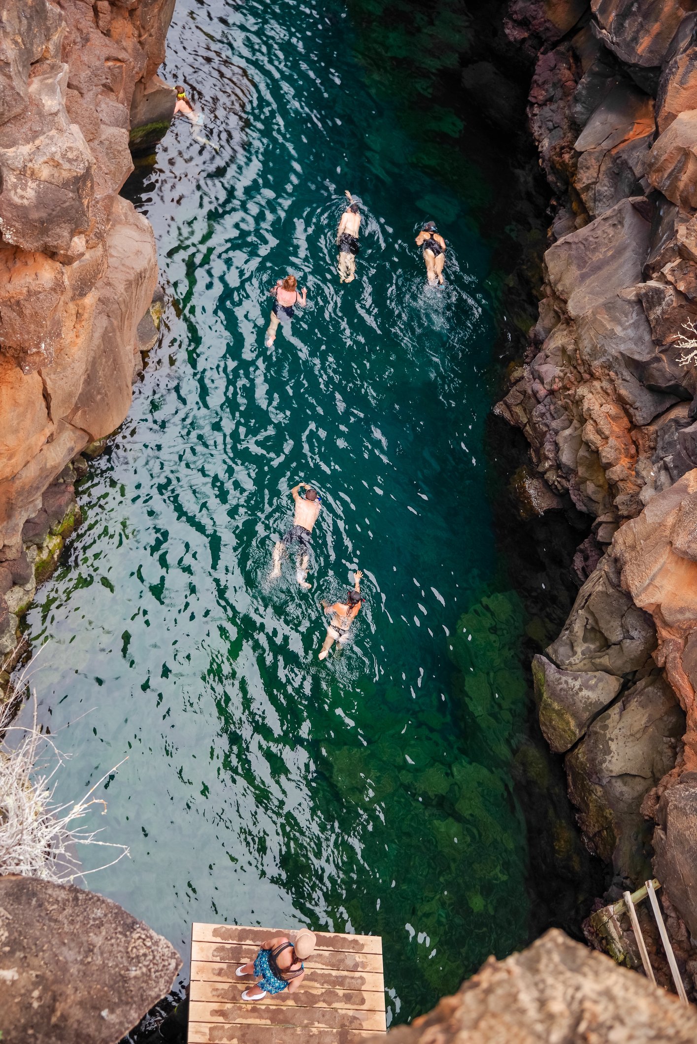 Swimmers in Las Grietas Galapagos