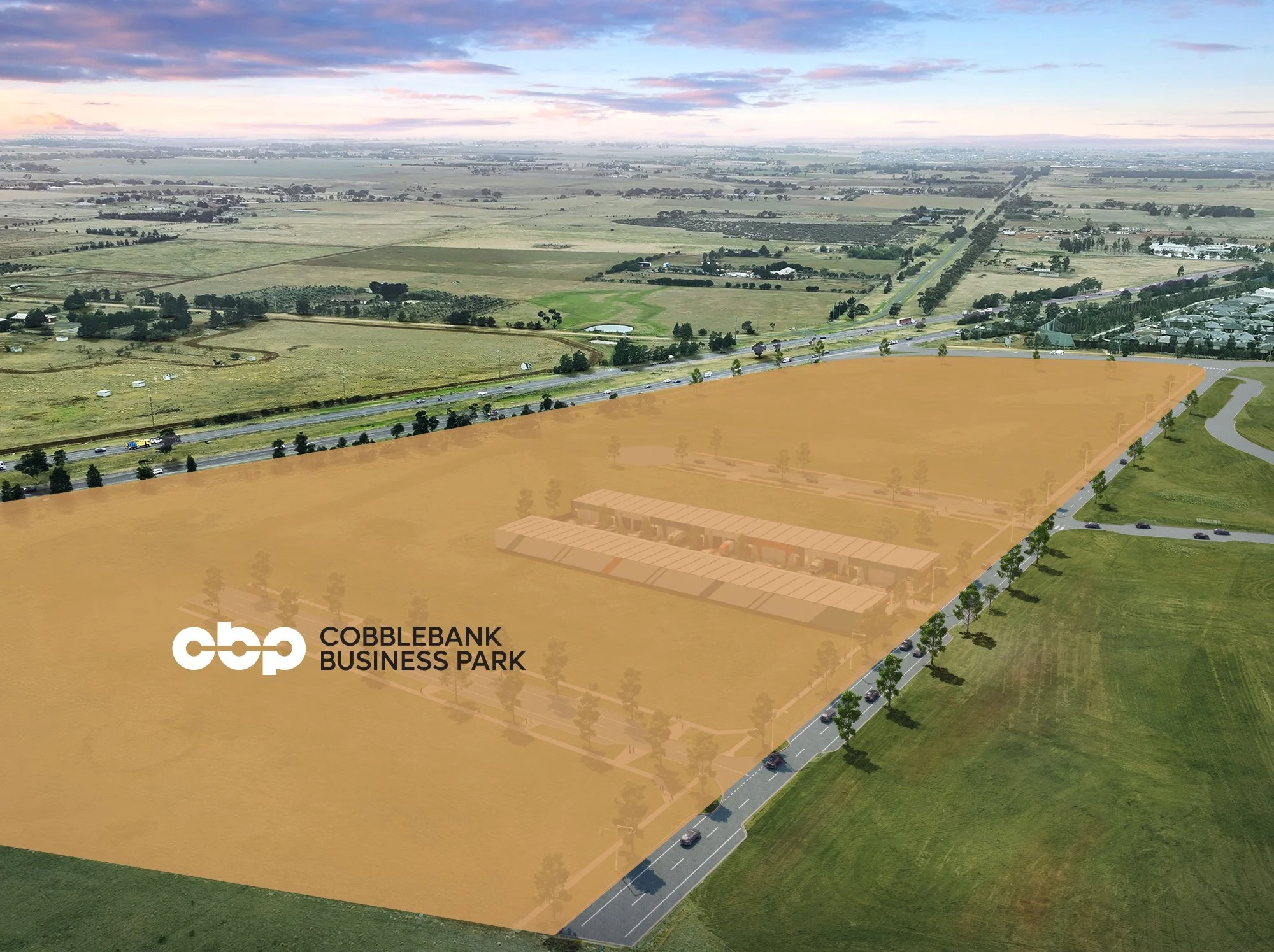 Aerial view of Cobblebank Business Park.The park includes a row of buildings and is surrounded by roads, green fields, infrastructure and residential areas nearby.