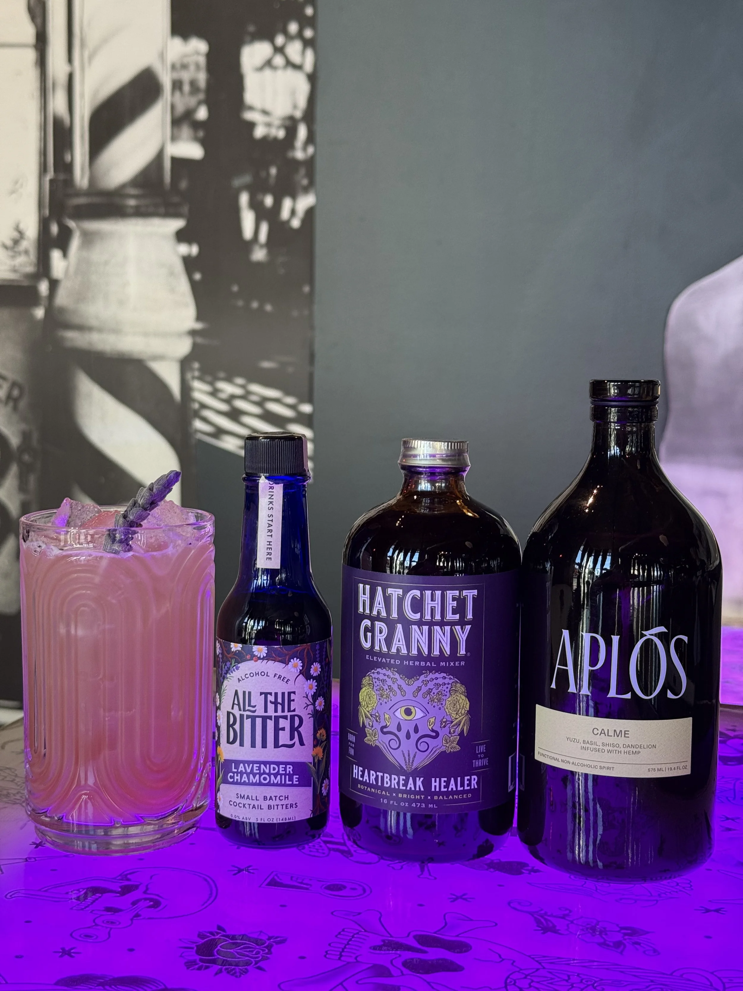 CBD cocktail made with Aplos Calme, Hatchet Granny Elixir, and All the Bitter Lavender Bitters